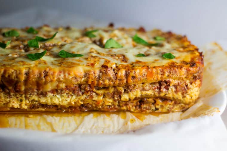 A side view of the layers of a plantain lasagna out of the loaf pan.