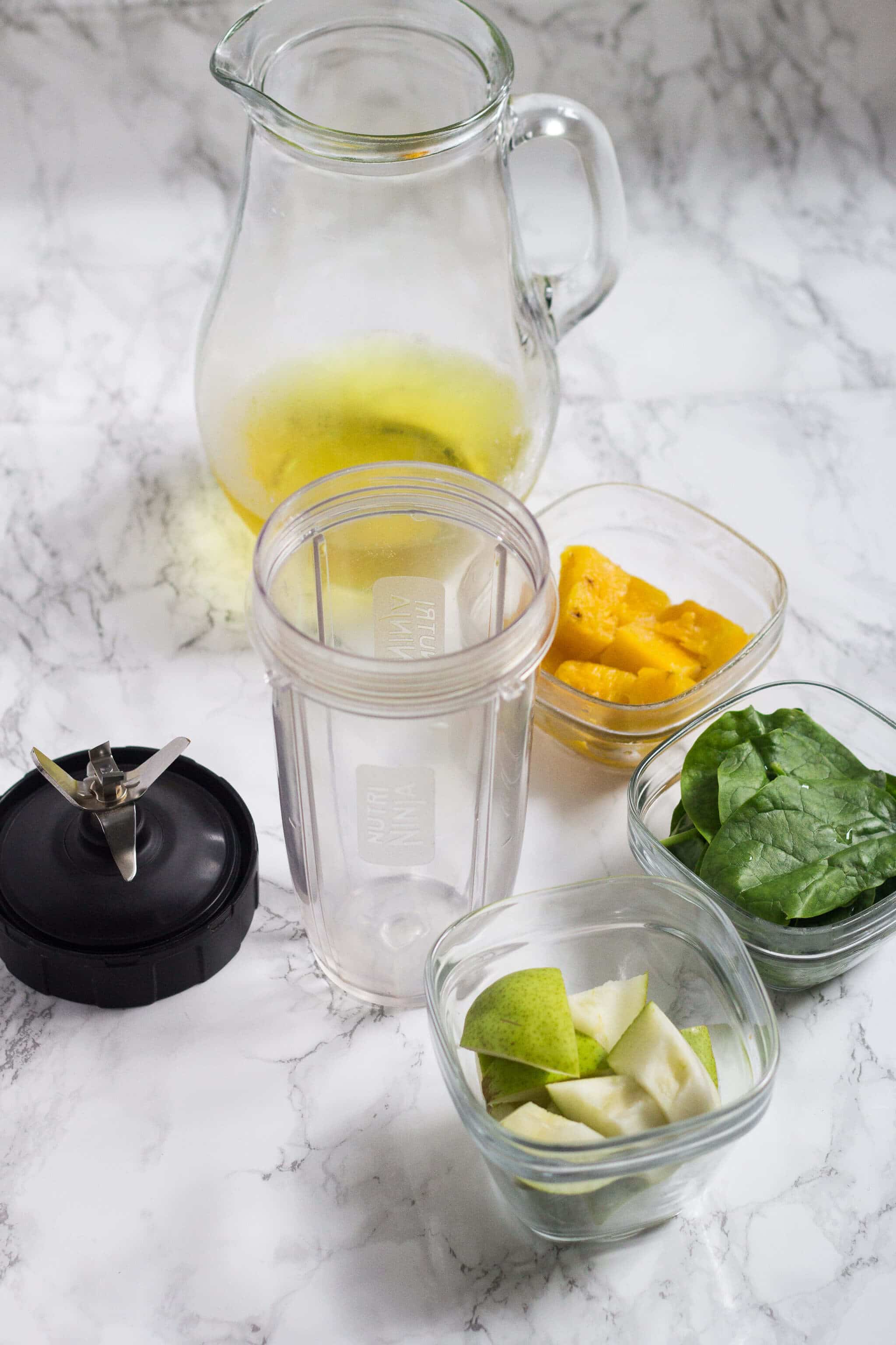 Green Tea Smoothie ingredients: cold brewed green tea, frozen pineapple, green pear, fresh spinach