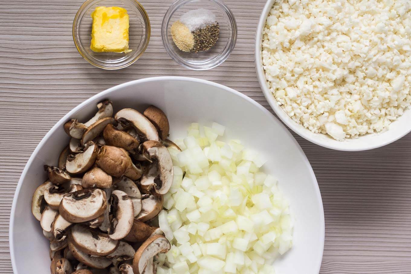 Ingredients: uncooked cauliflower rice, sliced mushrooms, onion, butter, garlic powder, salt, pepper